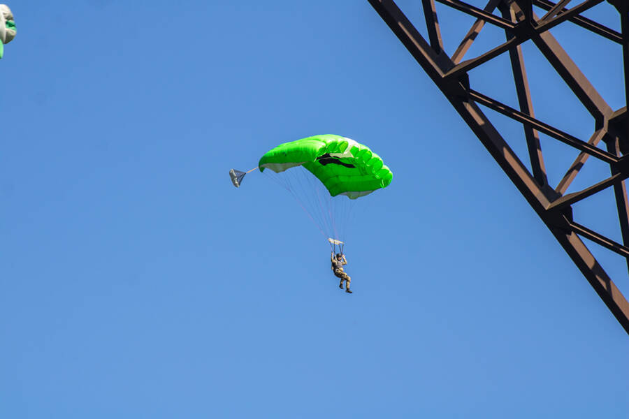 BASE jumper with green parachute