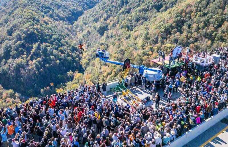 Crowd watching BASE jumpers on Bridge Day
