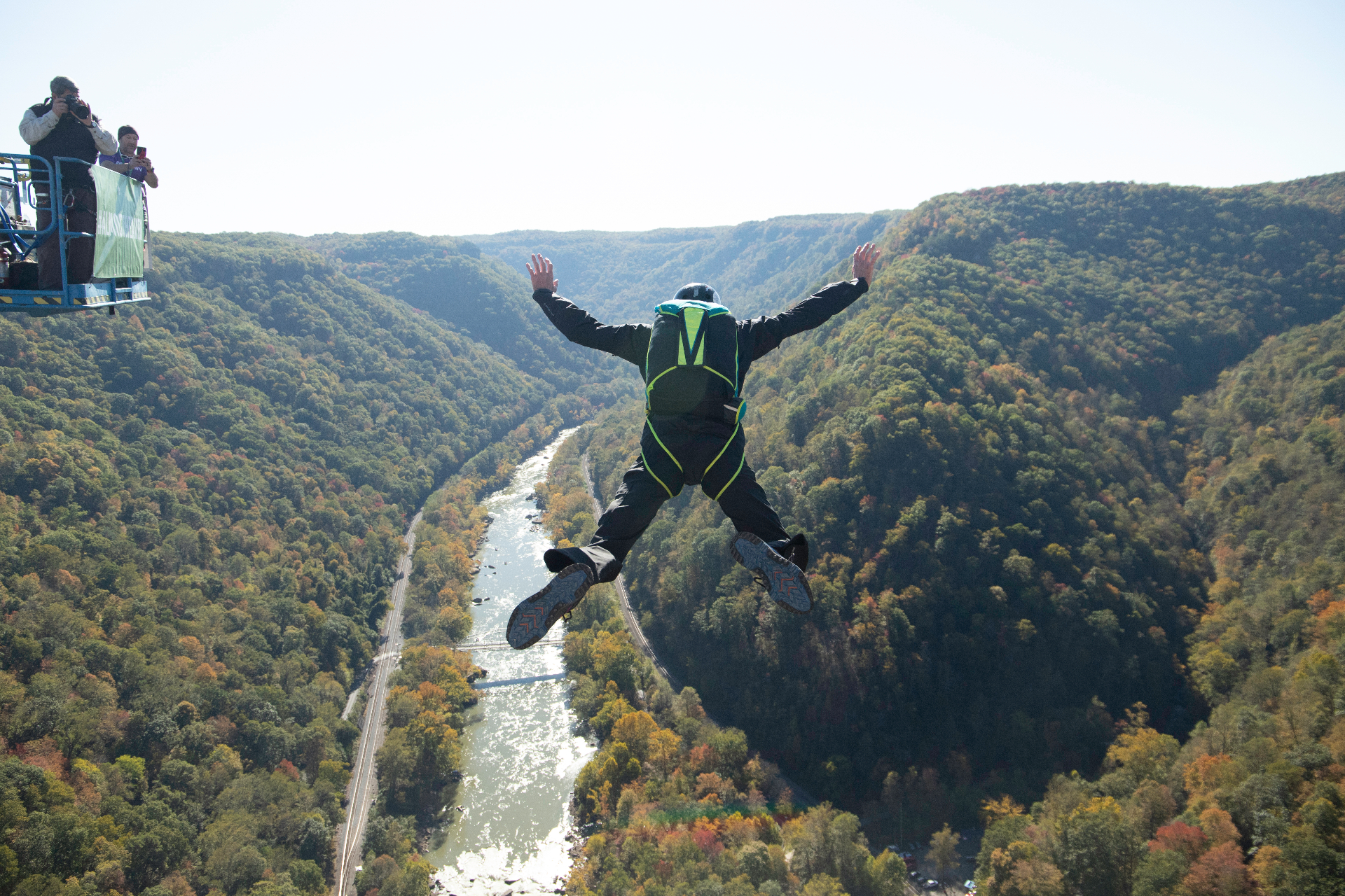 Rappellers descending from the New River Gorge Bridge on Bridge Day