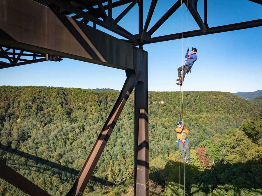Rappellers under the bridge structure