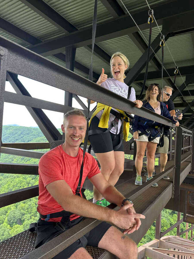 Group having fun on the bridge catwalk