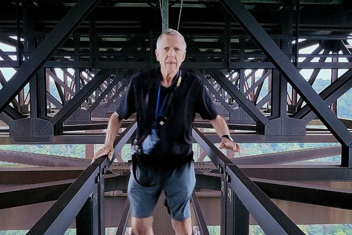 a man standing on a bridge