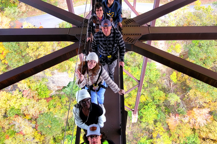 a person standing in front of a bridge